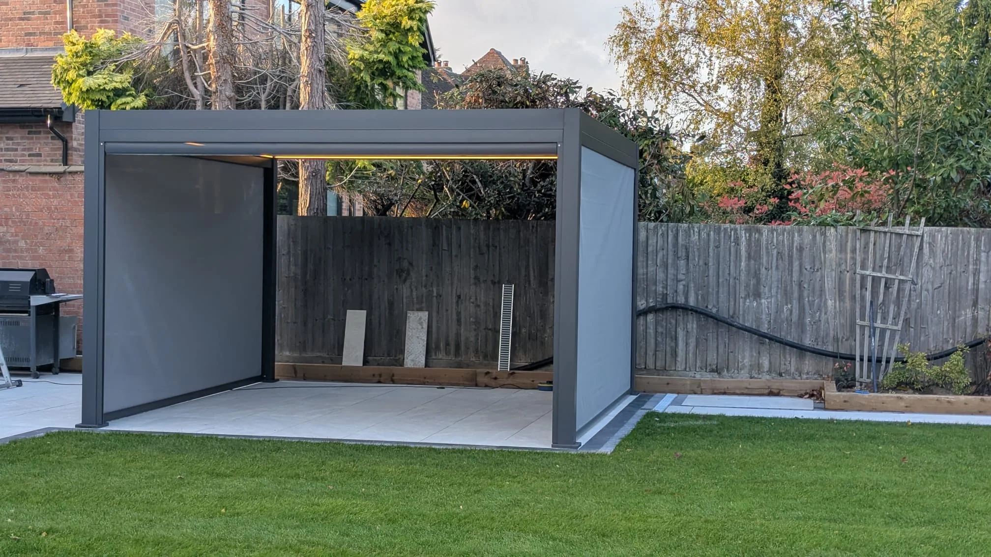 LuxShade™ 3×4m Aluminium Pergola with LEDs, Double-Layered Louvred Roof & 3 Blinds - Image 9